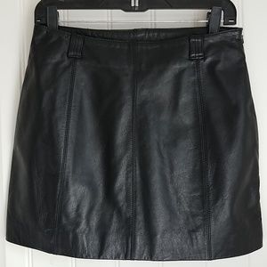 Black leather mini skirt.